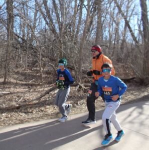 Kids running with dad